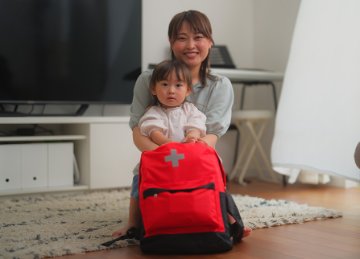 Mother and child with emergency kit